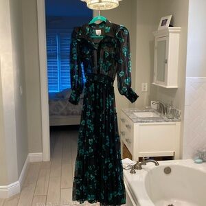 Stunning dress with black sheer top and arms.